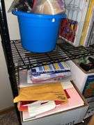 Metal shelf unit, education materials all in closet