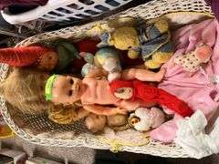 Old and older dolls, bassinet and stand