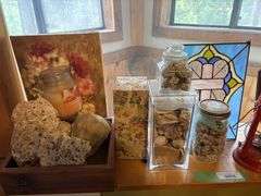 Decorative rocks and shells, stained glass, clock, candles and candle warmers