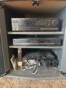 Entertainment center - with DVD player RCA DVD home theater system, pioneer stereo, and Wii gaming system