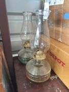 Two matching oil lamps
