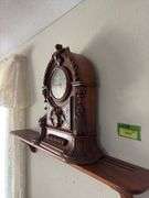 Antique walnut key wind shelf clock, very ornate carved case. Not sure if American or European ???