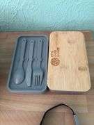 Two cake pans with lids and lunch kit