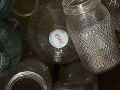 Various glass bottles and jars includes blue glass, Coca-Cola 1 gallon bottle, old soda bottles, etc