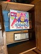 Contents of wardrobe includes 4th of July decor and many vintage kitchen utensils