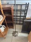 Antique cast-iron birdcage holder with vintage wooden cage