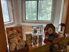 Decorative rocks and shells, stained glass, clock, candles and candle warmers