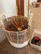 Basket of large tinker toys and Erector set pieces