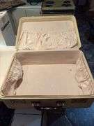 Vintage suitcase, picnic basket and wooden Coast to Coast level