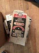 Grocery sack and box full of old cartridge boxes, most empty, some have hulls. Good man cave decor