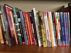 LOTS of paperback books 3 shelves