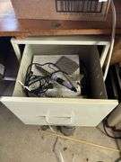 Desk, file cabinet and drawer full of stained glass making items