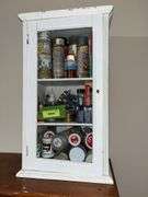 10D x 14L x 24H old wooden cabinet full of paints, glitter, etc...