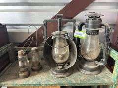 Two Dietz lanterns and two small skaters lanterns