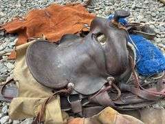 Vintage saddle, chaps, and saddle, blanket with beaded detail