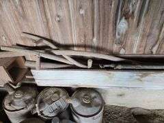 Oil, old gas cans, buckets, cast iron skillet, nails and more All on and under shelf