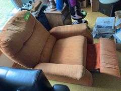 Orange recliner with telephone table and table lamp