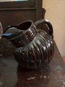 Two vintage juice pitchers-Ruby red ball and clear glass with fruit design