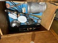 Contents of wardrobe includes 4th of July decor and many vintage kitchen utensils
