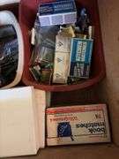 Typical junk drawer items, hand tools, key chains, book matches, etc