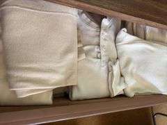 Contents of dresser includes men’s thermals size L, women’s flannel shirts size M, sweaters, heavy undershirts, jeans Clothing is all sizes