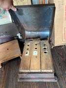 Hat boxes, old suitcase, wooden crutches, canning jars, cane, Booth Special foot warmer???