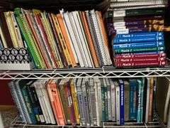 2 white metal shelf units, oak bookcase and LOTS AND LOTS of education materials BRING YOUR BOXES