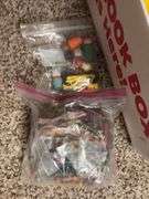 Box of assorted Fisher Price people and animals along with a bunch of other small toy items