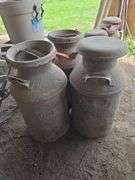 Milk can marked State Brand Mason City and 2 other rusty cans
