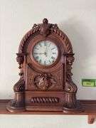 Antique walnut key wind shelf clock, very ornate carved case. Not sure if American or European ???