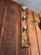 Raccoon hat, horseshoe gun rack