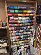 Huge quantity of ribbons and dispenser rack plus lots of gift wrapping items