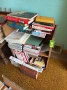 Small bookcase full of all kinds of reading materials