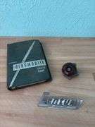Steering wheel knob, Century Cedar Rapids, Iowa car emblem and 1959 Futuramic Oldsmobile handbook
