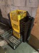 Plastic dairy crates and one wire carrier