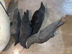 3 snow goose decoys and 4 crow decoys