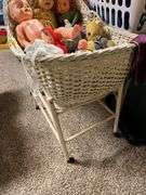 Old and older dolls, bassinet and stand