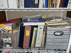 White metal shelf unit full of education materials BRING YOUR BOXES