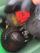 Large tote full of camping supplies, including sleeping bags, camping cookware set, propane burner, bag of rope and more