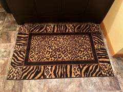 African animal prints and decor, rug, towels, fold up drying rack