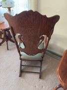 Antique oak platform rocker with needlepoint seat, veneer has small chip on back