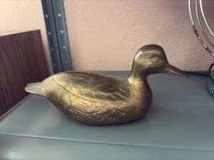 Heavy brass duck