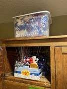 Contents of wardrobe includes 4th of July decor and many vintage kitchen utensils