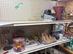 Two sided store display rack and all contents mostly crafting items