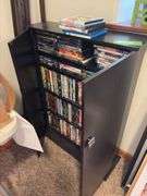 160+ DVDs and storage cabinet