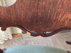 Antique oak platform rocker with needlepoint seat, veneer has small chip on back