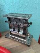 Vintage kitchen items includes Betty Crocker cookbook, serving trays, toaster and cake server