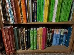 2 white metal shelf units, oak bookcase and LOTS AND LOTS of education materials BRING YOUR BOXES