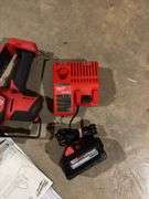 Milwaukee Fuel M18 pruning saw with battery and charger