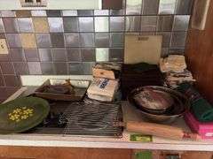 Kitchen scrubbers, rolling pins, mixing bowls, serving trays, hand towels, etc and a drawer of kitchen utensils